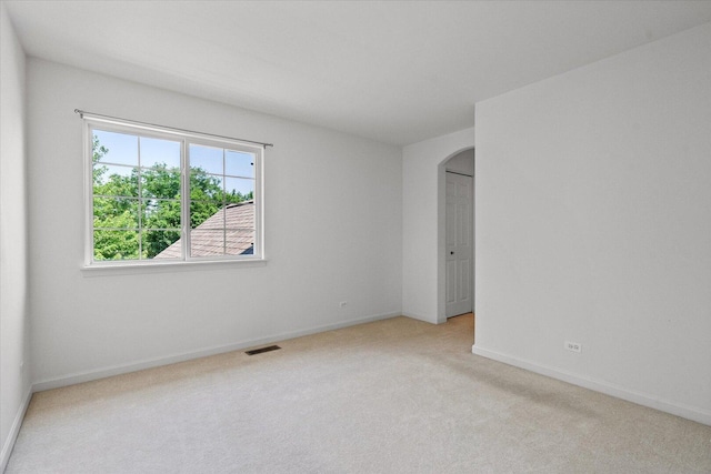 270 Birch Ln, Saint Charles, IL 60175 - empty room with arched walkways and light carpet