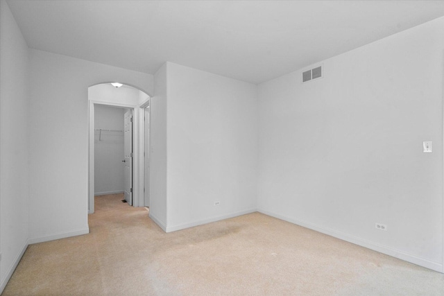 270 Birch Ln, Saint Charles, IL 60175 - empty room with arched walkways and light colored carpet