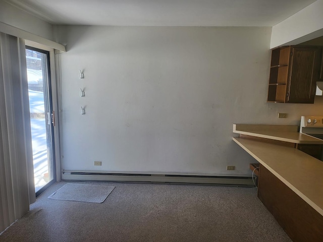 32 Montego Colony Unit 7, Fox Lake, IL 60020 - kitchen with plenty of natural light, carpet, open shelves, and a baseboard heating unit