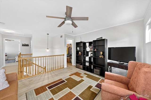 620 S Annandale Dr, Lake In The Hills, IL 60156 - living room featuring a ceiling fan, wood finished floors, attic access, and crown molding
