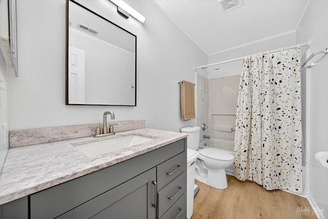 620 S Annandale Dr, Lake In The Hills, IL 60156 - bathroom with wood finished floors, vanity, and shower / bath combo with shower curtain