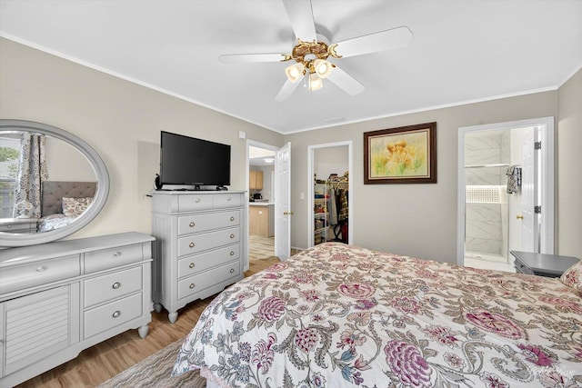620 S Annandale Dr, Lake In The Hills, IL 60156 - bedroom with light wood-type flooring, a walk in closet, ornamental molding, ensuite bathroom, and ceiling fan