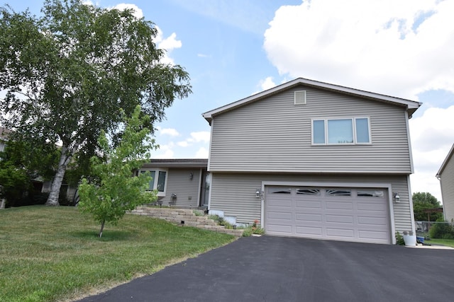 963 E Castlewood Ln, Bartlett, IL 60103 - view of front of home with an attached garage, driveway, and a front yard