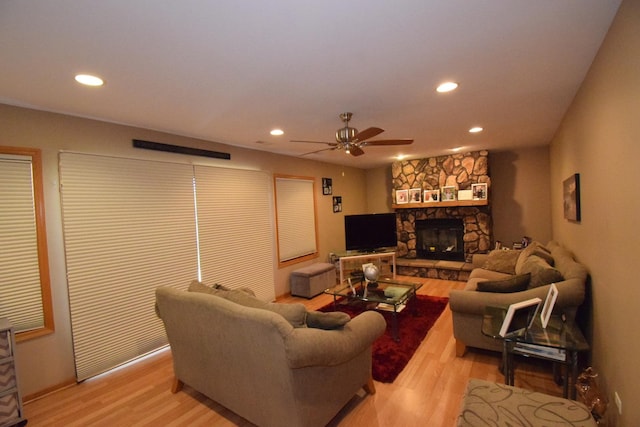 963 E Castlewood Ln, Bartlett, IL 60103 - living area with light wood-style flooring, ceiling fan, recessed lighting, and a stone fireplace