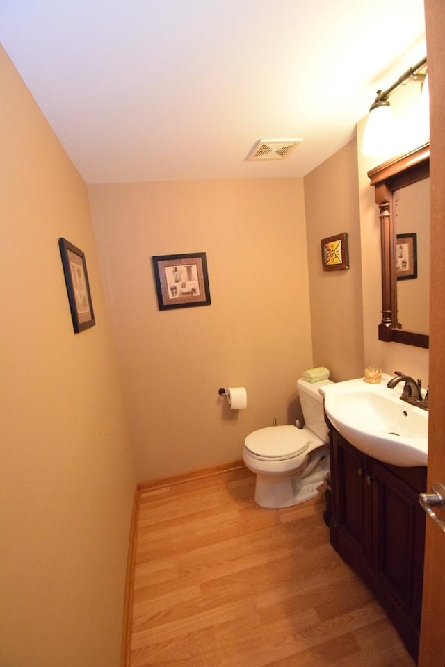 963 E Castlewood Ln, Bartlett, IL 60103 - half bathroom with vanity and wood finished floors