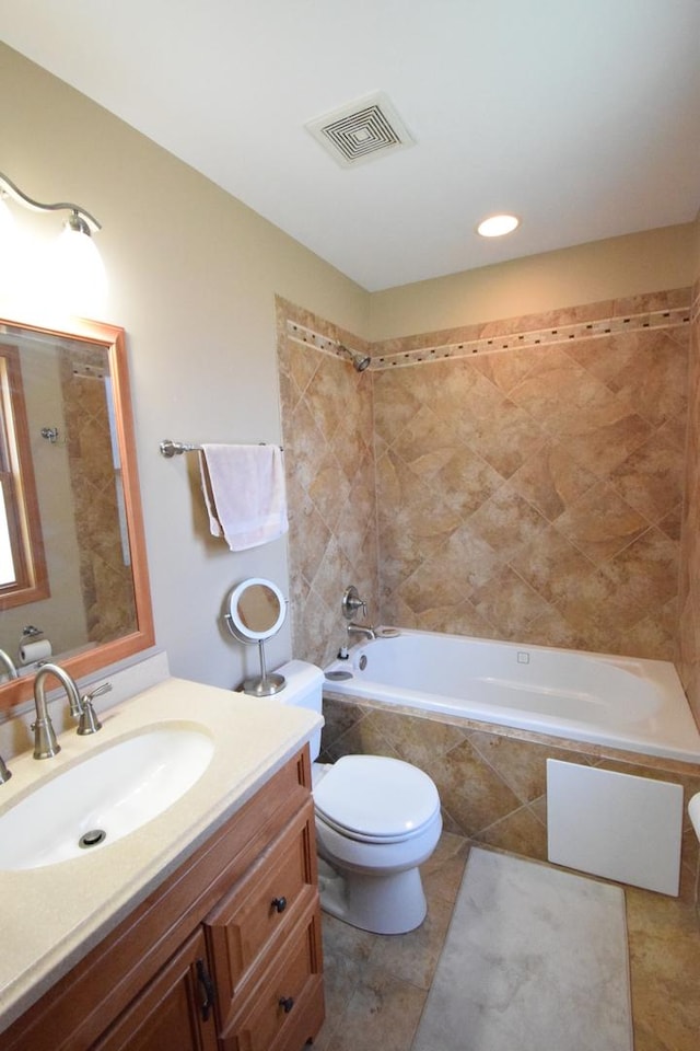 963 E Castlewood Ln, Bartlett, IL 60103 - bathroom featuring vanity, tiled shower / bath, and tile patterned floors