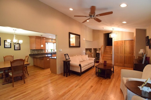 963 E Castlewood Ln, Bartlett, IL 60103 - living area featuring light wood-style floors, a chandelier, ceiling fan, stairway, and recessed lighting