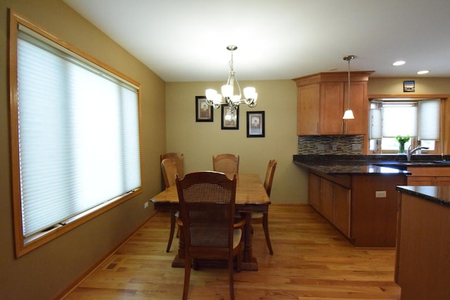 963 E Castlewood Ln, Bartlett, IL 60103 - dining area with light wood-type flooring, a chandelier, and recessed lighting