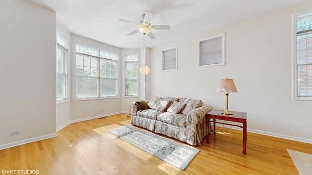 4606 S Woodlawn Ave, Chicago, IL 60653 - living room with a ceiling fan, healthy amount of natural light, and wood finished floors