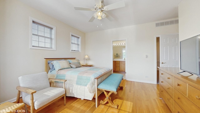 4606 S Woodlawn Ave, Chicago, IL 60653 - bedroom with light wood-style floors, ceiling fan, and ensuite bath