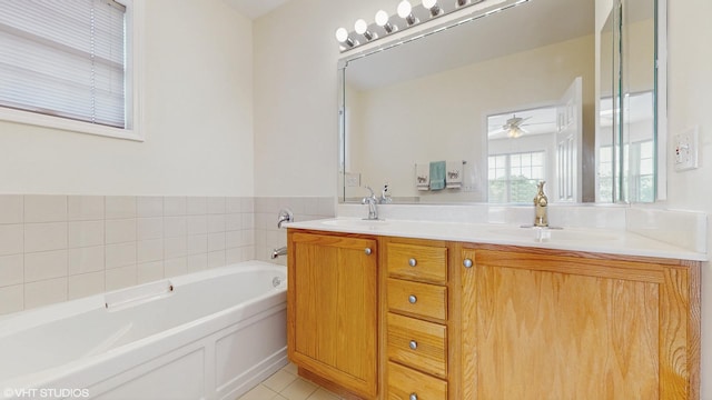4606 S Woodlawn Ave, Chicago, IL 60653 - bathroom featuring double vanity, a garden tub, a ceiling fan, and tile patterned floors