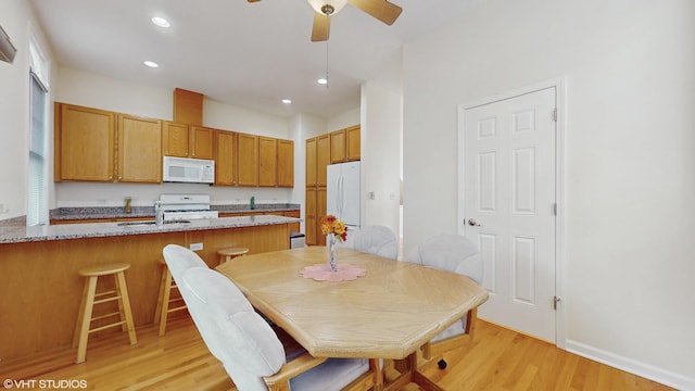 4606 S Woodlawn Ave, Chicago, IL 60653 - dining space featuring light wood-style floors, recessed lighting, and a ceiling fan