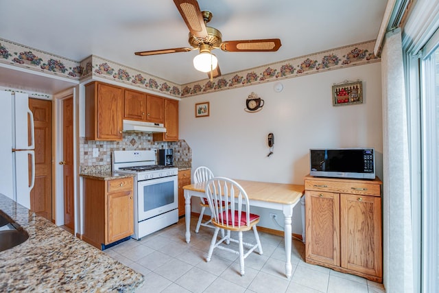7315 Winthrop Way Unit 6, Downers Grove, IL 60516 - kitchen featuring white appliances, under cabinet range hood, tasteful backsplash, and light tile patterned floors