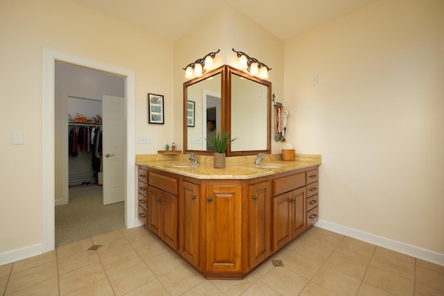 660 Birch Hollow Dr, Antioch, IL 60002 - bathroom featuring double vanity, tile patterned flooring, and a walk in closet