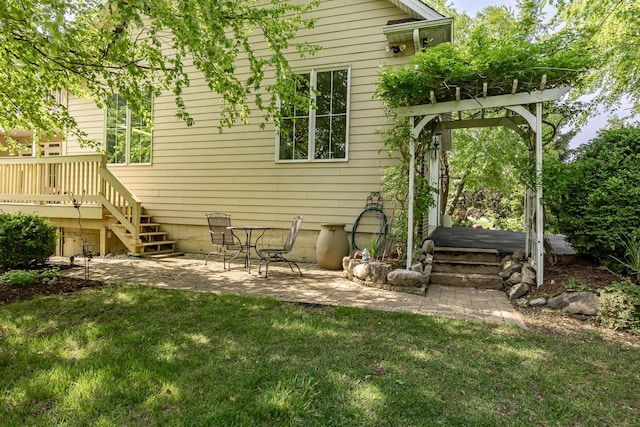660 Birch Hollow Dr, Antioch, IL 60002 - back of property with a lawn, a patio area, a wooden deck, and stairs