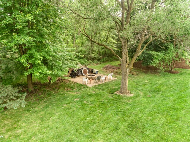 660 Birch Hollow Dr, Antioch, IL 60002 - view of grassy yard featuring a fire pit and a patio