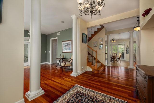 660 Birch Hollow Dr, Antioch, IL 60002 - foyer with ornate columns, wood-type flooring, stairs, and a chandelier