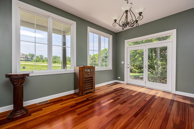 660 Birch Hollow Dr, Antioch, IL 60002 - empty room featuring a chandelier and wood finished floors