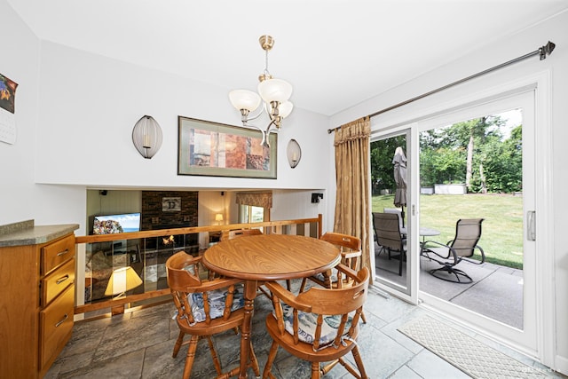 13520 Idlewild Dr, Orland Park, IL 60462 - dining space featuring a chandelier and a fireplace