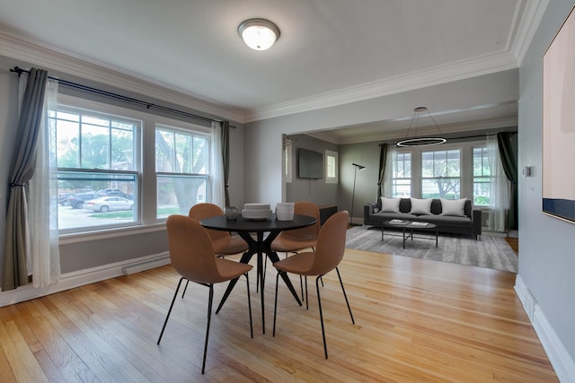 7530 Brown Ave, Forest Park, IL 60130 - dining area featuring plenty of natural light, ornamental molding, wood finished floors, and baseboard heating