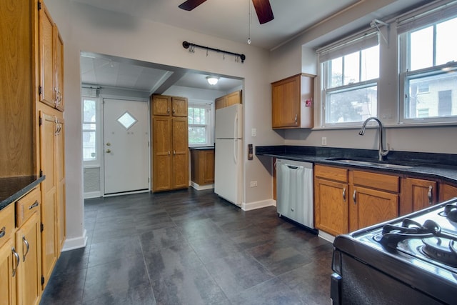 7530 Brown Ave, Forest Park, IL 60130 - kitchen with freestanding refrigerator, dishwasher, black gas stove, a ceiling fan, and brown cabinets