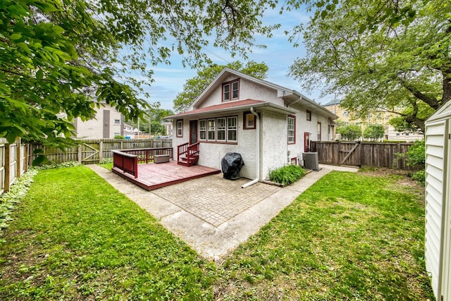 7530 Brown Ave, Forest Park, IL 60130 - back of house featuring a fenced backyard, a wooden deck, a patio, and stucco siding