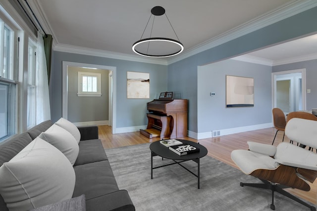 7530 Brown Ave, Forest Park, IL 60130 - living room with light wood-style floors and ornamental molding