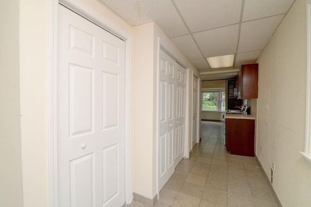 215 W Kimbell Ave, Elmhurst, IL 60126 - hallway with a paneled ceiling and light tile patterned flooring