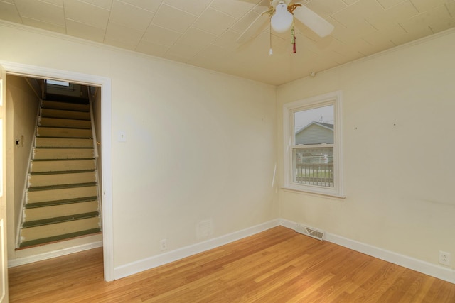 215 W Kimbell Ave, Elmhurst, IL 60126 - unfurnished room with crown molding, light wood finished floors, ceiling fan, and stairs