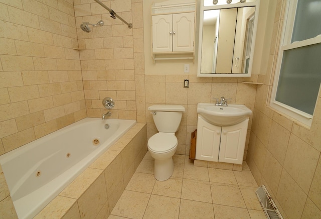 215 W Kimbell Ave, Elmhurst, IL 60126 - full bath with vanity, a combined bath / shower with jetted tub, tile patterned floors, and tile walls