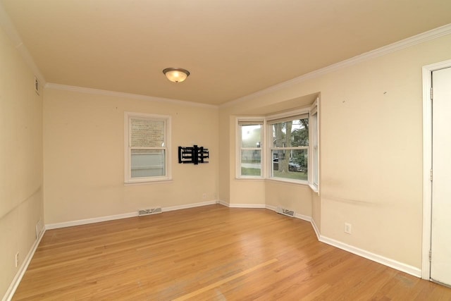 215 W Kimbell Ave, Elmhurst, IL 60126 - empty room with crown molding and light wood-style floors