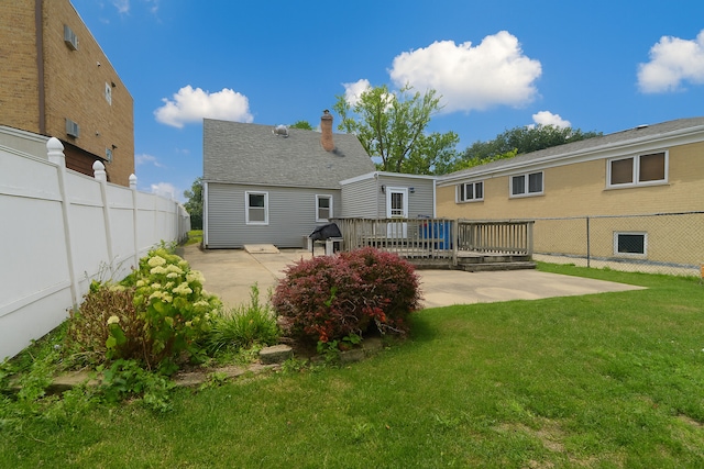 215 W Kimbell Ave, Elmhurst, IL 60126 - back of property with a patio and a wooden deck