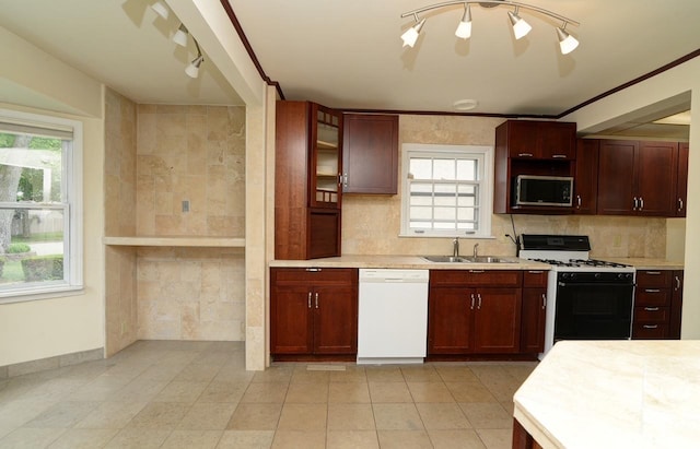 215 W Kimbell Ave, Elmhurst, IL 60126 - kitchen with dishwasher, gas stove, stainless steel microwave, light countertops, and glass insert cabinets