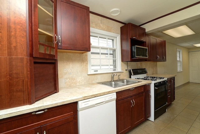 215 W Kimbell Ave, Elmhurst, IL 60126 - kitchen with dishwasher, black range with gas cooktop, stainless steel microwave, reddish brown cabinets, and light countertops