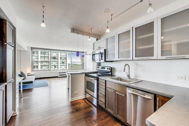 3600 N Lake Shore Dr Unit 2204, Chicago, IL 60613 - kitchen with stainless steel appliances, glass insert cabinets, dark wood-type flooring, hanging light fixtures, and rail lighting