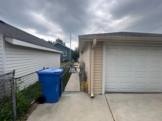 5542 W Grace St, Chicago, IL 60641 - garage featuring a gate and driveway