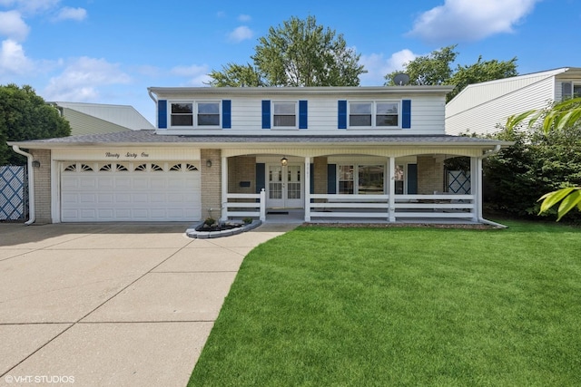 9061 Primrose Ln, Hickory Hills, IL 60457 - view of front of home featuring driveway, brick siding, covered porch, and french doors