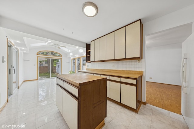 9061 Primrose Ln, Hickory Hills, IL 60457 - kitchen with wood counters, open shelves, white refrigerator with ice dispenser, ceiling fan, and a kitchen island