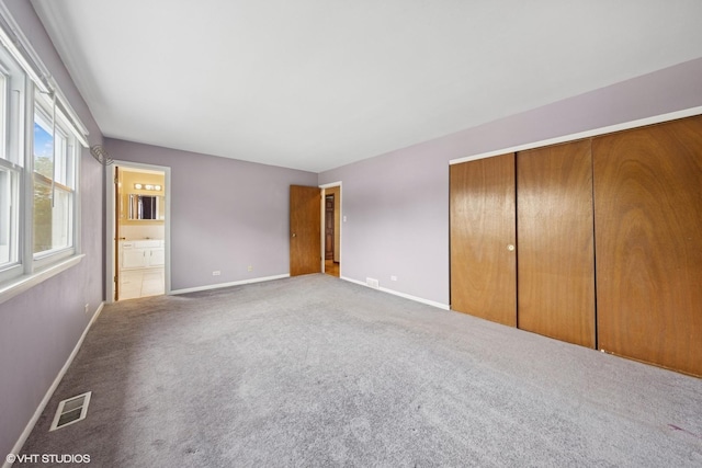 9061 Primrose Ln, Hickory Hills, IL 60457 - unfurnished bedroom featuring carpet, a closet, and ensuite bathroom