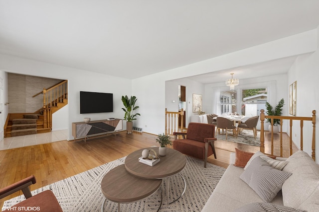 9061 Primrose Ln, Hickory Hills, IL 60457 - living area featuring a chandelier, light wood-type flooring, and stairs
