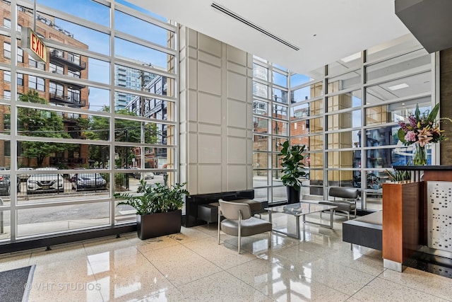 700 N Larrabee St Unit 1409, Chicago, IL 60654 - building lobby with a high ceiling, expansive windows, and a city view