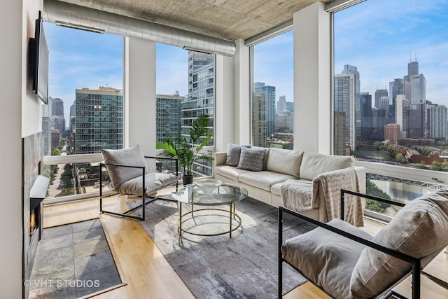 700 N Larrabee St Unit 1409, Chicago, IL 60654 - living room with a skyline view, wood finished floors, and a wall of windows