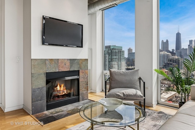 700 N Larrabee St Unit 1409, Chicago, IL 60654 - living area featuring wood finished floors and a tiled fireplace