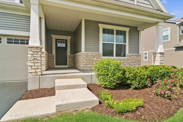 1140 River Birch Blvd, Crystal Lake, IL 60012 - entrance to property with stone siding, covered porch, and an attached garage