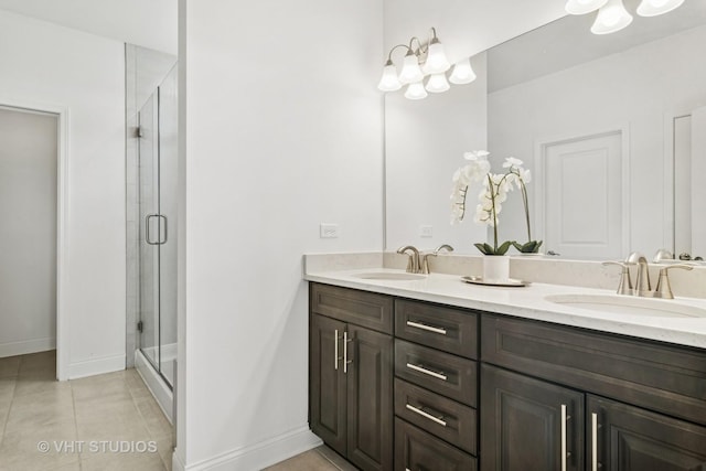 1140 River Birch Blvd, Crystal Lake, IL 60012 - bathroom with double vanity, a shower stall, tile patterned floors, and a chandelier