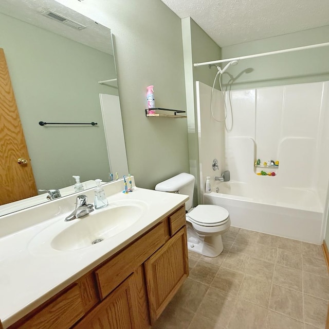 15538 Finley Way Unit 2, South Beloit, IL 61080 - full bathroom featuring vanity, shower / tub combination, and a textured ceiling