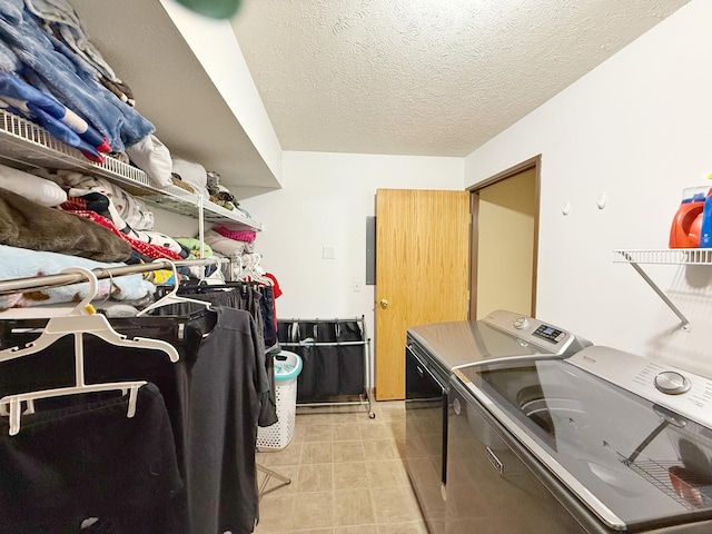 15538 Finley Way Unit 2, South Beloit, IL 61080 - washroom featuring washer and clothes dryer and a textured ceiling