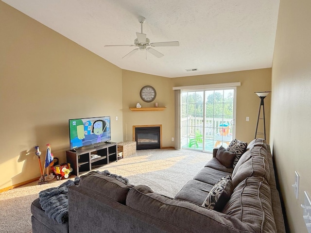 15538 Finley Way Unit 2, South Beloit, IL 61080 - living room featuring carpet floors, ceiling fan, a glass covered fireplace, and vaulted ceiling