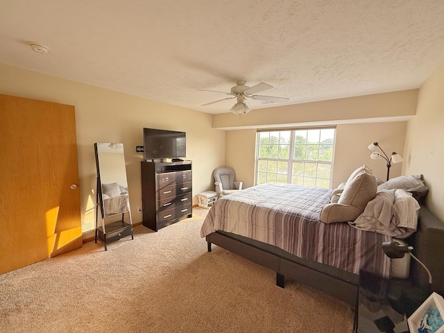 15538 Finley Way Unit 2, South Beloit, IL 61080 - bedroom featuring light colored carpet, a ceiling fan, and a textured ceiling