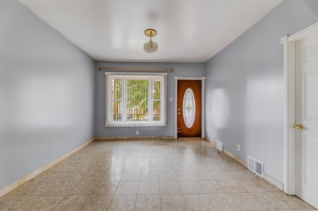 3928 W 63rd Pl, Chicago, IL 60629 - foyer with baseboards and light tile patterned floors